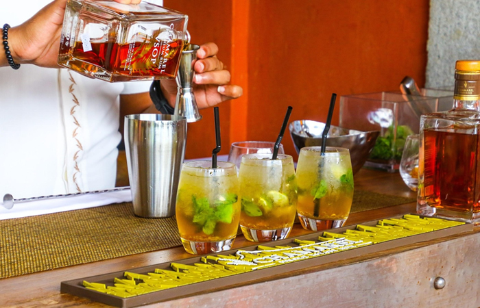 Mixing a cocktail with rum. 